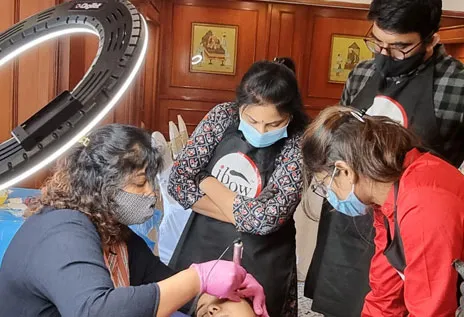 Day 3: Dr. Gunjan Shah guiding her students during a hands-on Permanent Makeup training session.